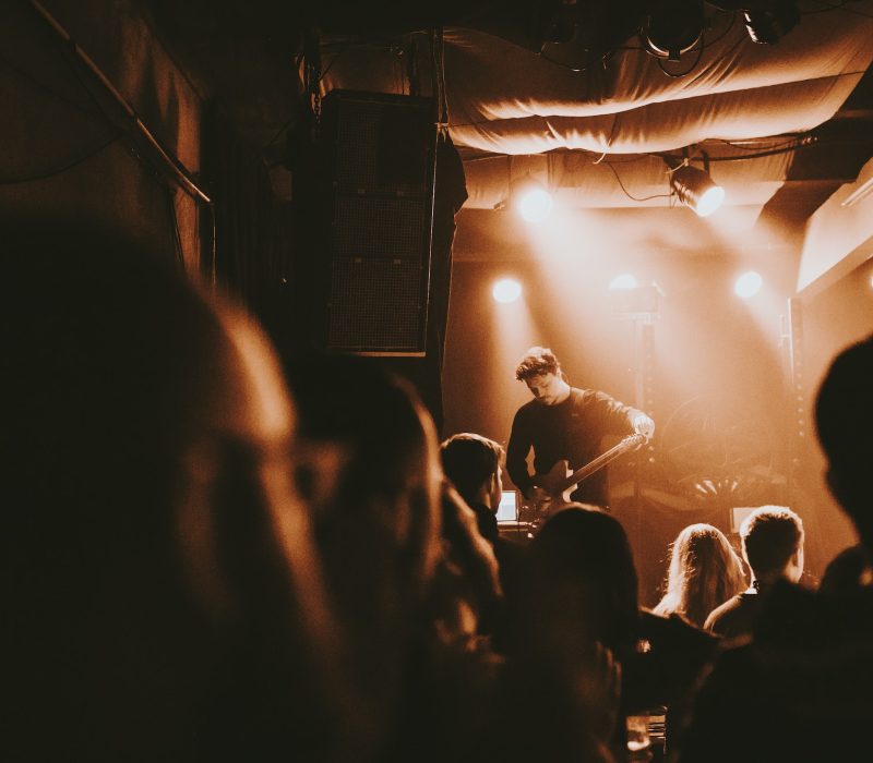 guitarist-playing-an-electric-guitar-in-a-concert-1.jpg