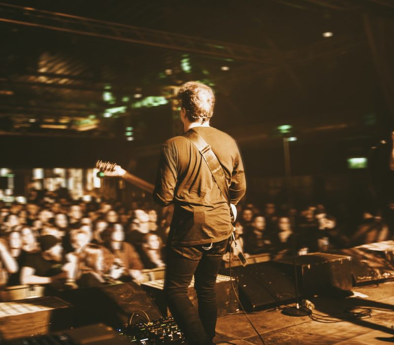 guitarist-playing-in-a-concert.jpg